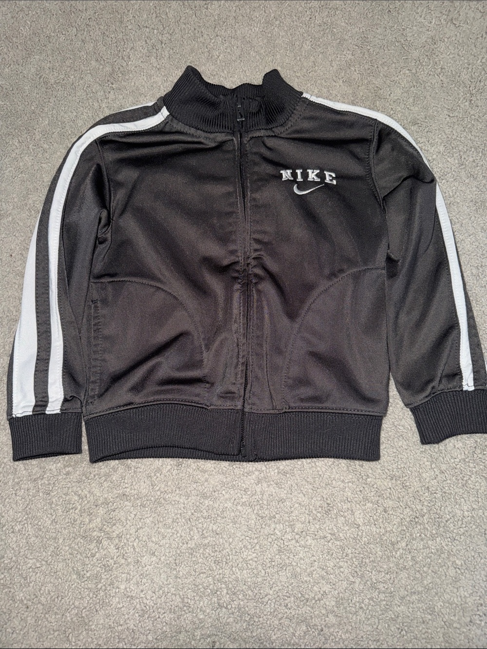 Nike Black Kids Track Jacket with White Sleeve Stripes